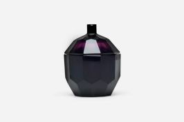 An amethyst glass lidded vessel designed by Joseph Hoffmann, manufactured in Austria, circa 1923, by Moser Karlsbad for the Wiener Werkstatte. Measurements: 4.5 in. wide, by 4.25 in. deep, by 5.5 in. high.
