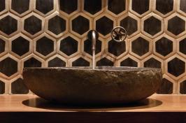 Bold+wall+tile%2c+a+stone+sink%2c+and+a+simple+wall-mounted+fixture+might+not+work+in+a+bigger+or+busier+bath%2c+but+here%2c+they+pack+a+visual+punch.