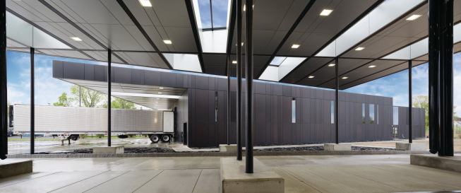 A truck moves through the commercial traffic checkpoint under the canopy at the new U.S. Land Port of Entry in Van Buren, Maine.