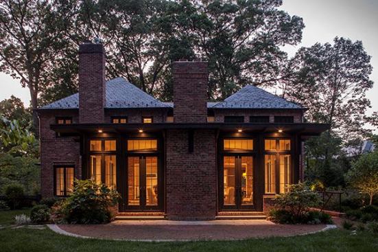 To address the owners' need to entertain guests, Muse Architects designed a contexual addition for this brick house that creates more rooms and opens up spaces. A new family room extends into the yard behind the home.