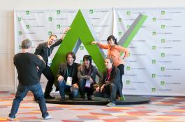 Attendees posed next to the Autodesk University logo sculpture.