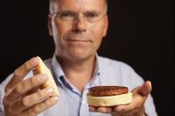 Professor Mark Post holds the world's first hamburger grown in a laboratory.