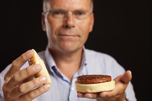 Professor Mark Post holds the world's first hamburger grown in a laboratory.