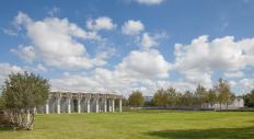 South façades of the new Renzo Piano Building Workshop-designed pavilion to the left and the existing Louis Kahn-designed building to the right, separated by a 65-yard-wide lawn. Photographed September 2013.