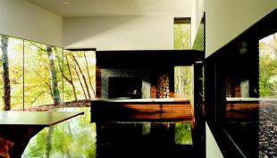 With its abstracted building forms and deftly controlled surfaces matte on the outside, highly polished within this single-purpose building delivers multiple layers of surprise.