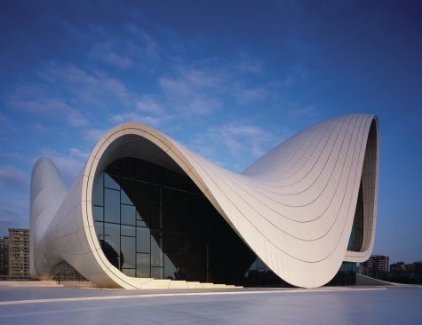 The+building%e2%80%99s+program+is+expressed+in+its+form%2c+with+galleries+housed+in+the+foremost+volume%2c+and+a+multistory+library+in+the+tower+at+the+rear.