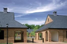 By facing the dormitory buildings onto a central lawn, Muse Architects bestowed a small-town feeling on the project. Residents enjoy various levels of public space, including generously sized loggias and a communal lounge.