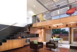 Changes in cabinet depth indicate a subtle shift from living space to kitchen