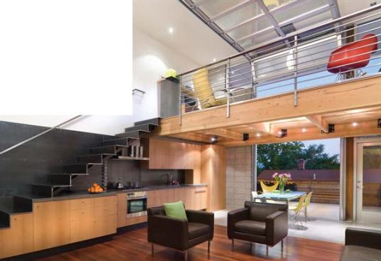 Changes in cabinet depth indicate a subtle shift from living space to kitchen