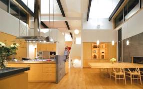 Every element of the kitchen expresses the clients wish for functionality coupled with modern design. Natural materials help bring cohesiveness to the large and open space.