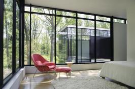 Simple architecture is echoed by a simple palette of stucco, fiber cement, and ebony and zebra woods.