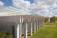 The new Renzo Piano Building Workshop-designed pavilion at the Kimbell Art Museum in Fort Worth, Texas, as seen from the southwest. The existing Louis Kahn-designed museum can be seen across the lawn, beyond. Photographed September 2013.