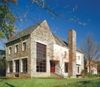 Traditional materials and forms help this contemporary home fit into its neighborhood.