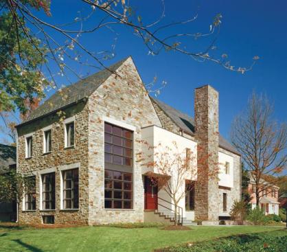 Traditional materials and forms help this contemporary home fit into its neighborhood. 