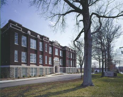 Sherman-Carter-Barnhart Architects faithfully preserved all the generous window openings and exterior details in the school-to apartment conversion.