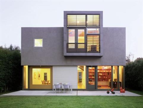 Koning Eizenberg concentrated its limited design dollars in places where they would have the most impact, such as the louvered master bedroom pop-out window and the oversized, picture-frame doors on the front and rear elevations
