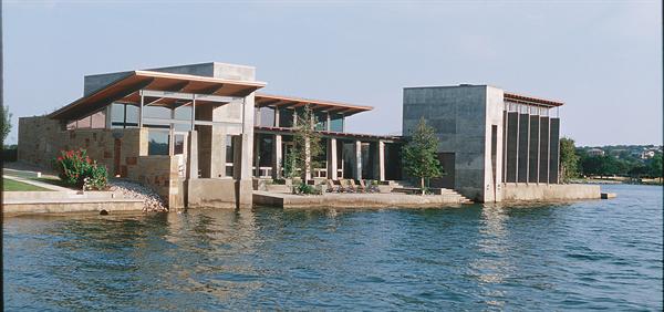 A covered porch connects the houses living spaces and slips down to the water. At the end is the master suite,which is rotated slightly to give it more privacy and its own view. Kitchen storage is part of the architecture  Cabinets become a well defined