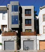 These decidedly modern row houses use familiar massing and scale to blend in with their Victorian neighbors.