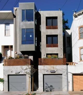 These decidedly modern row houses use familiar massing and scale to blend in with their Victorian neighbors.