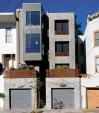 These decidedly modern row houses use familiar massing and scale to blend in with their Victorian neighbors.
