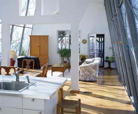 The design team controlled expenses by using off-site prefabrication, drywall, and IKEA cabinetry and countertops.