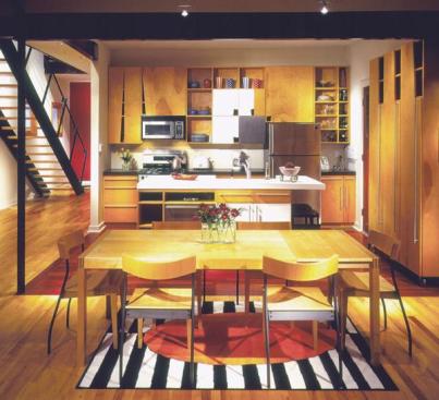 By skillfully mixing inexpensive materials in light colors, architect Todd Walker was able to create a kitchen that appears spacious and stylish on a relatively modest budget.