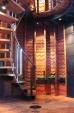A spiral staircase leads to a rooftop deck and stunning views.