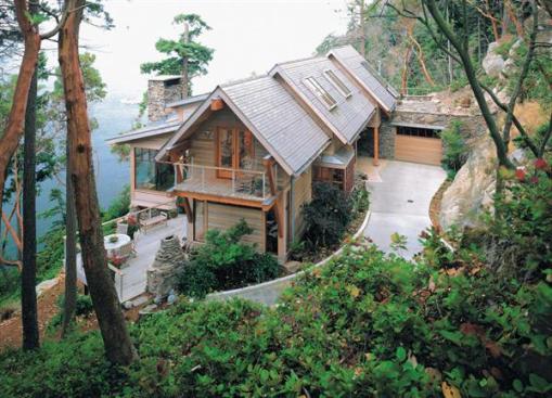 Seeming to grow out of its steep waterfront site, this new house impressed our judges with its thorough integration of earth forms and architecture.