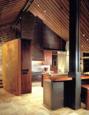 The bold geometry and unique combination of materials in this kitchen caught our judges eyes, but the same qualities integrate the room with its context: a bold and unique house.