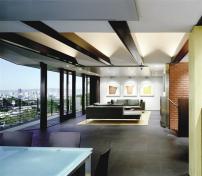 Sophisticated materials and colors, and a radically simplified look, make this 1950s house finally worthy of its extraordinary view.