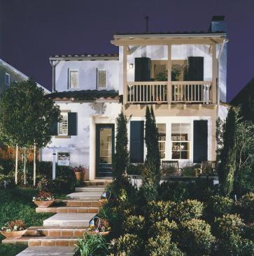 Varying front elevations and roof forms and complementary color schemes reinforce the individuality of these small homes.
