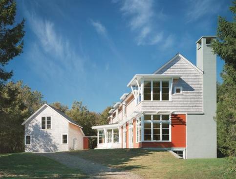 Main living spaces, such as the living room and kitchen, face south for maximum solar exposure.