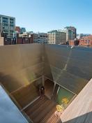 The south-facing, open-air cube can be used as a private courtyard or a corridor between the kitchen and family room.