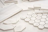 Marble is beautiful, but it can be fragile and prone to staining. Virtue, a porcelain tile from Crossville, serves as an alternative, blending the look of well-known marbles Carrara, Calacatta, and Statuario. The porcelain tile comes in unpolished and satin finishes, and in modular field sizes from 3”-by-6” to 24” square, and two mosaic sizes: 2” and 3” square. Trim options include chair rail, crown molding, base molding, single bullnose, cove base, and inside and outside corners. crossvilleinc.com