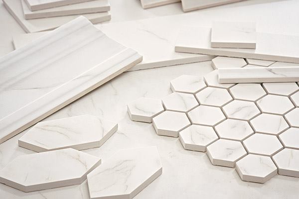 Marble is beautiful, but it can be fragile and prone to staining. Virtue, a porcelain tile from Crossville, serves as an alternative, blending the look of well-known marbles Carrara, Calacatta, and Statuario. The porcelain tile comes in unpolished and satin finishes, and in modular field sizes from 3”-by-6” to 24” square, and two mosaic sizes: 2” and 3” square. Trim options include chair rail, crown molding, base molding, single bullnose, cove base, and inside and outside corners. crossvilleinc.com