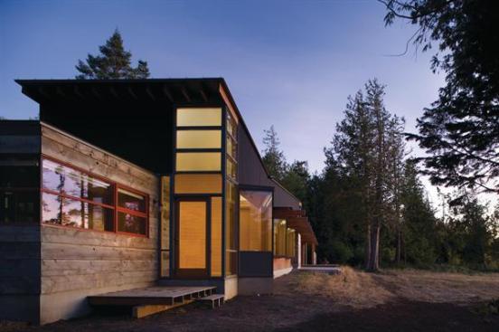 Bedroom window bays are canted toward Olympic Mountain views.