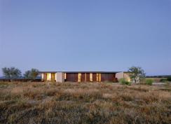 Weathering steel picks up on the landscape's darker hues.