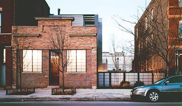 The architects set the new second and third floors back from the street elevation.