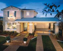 The plan features a game room behind the garage and aHollywood driveway.