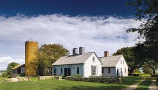 One of the two chimneys in the addition is a skylight that illuminates a bath.
