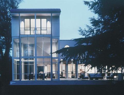 The glittering three-story steel framed tower is capped by a guest suite offering views of the Rappahannock River.
