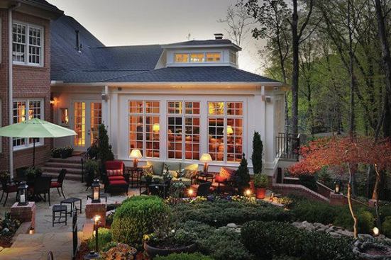 For this traditional Nashville home, Scott Wilson designed a sunroom that extends into the owners' beloved, carefully landscaped backyard.