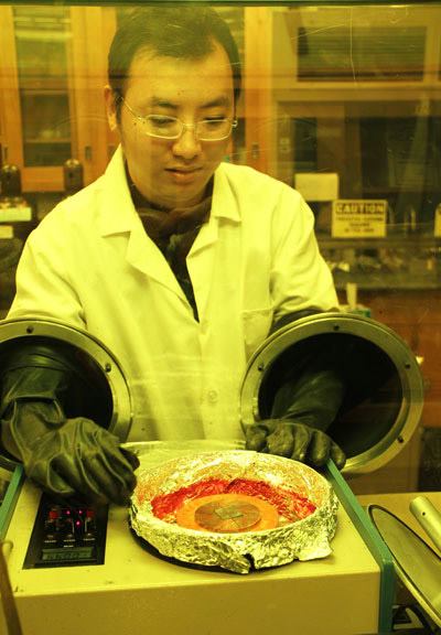 Researcher Min Cai creates a metal-oxide based OLED.
