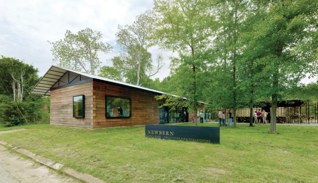 Designed and built by Rural Studio students in Newbern, Ala., the town hall is built out of stacked timbers. Sourced locally, the cypress beams were squared at 8 inches by 8 inches and are held together with a ½-inch threaded rod.