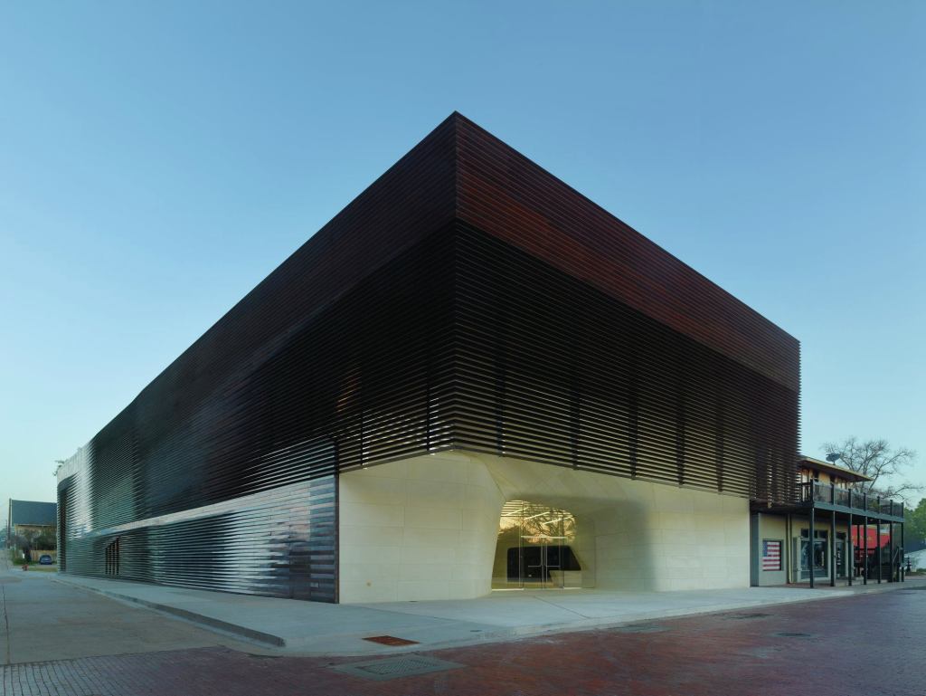 Clad in copper louvers, the open-air 'porch' at the front of the structure is intended as a modern interpretation of the porches and balconies of the surrounding structure, such as the Pioneer Pub next door.