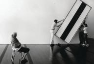 Dominique de Menil oversees workers as they hang a painting by Barnett Newman in the Menil Collection museum.