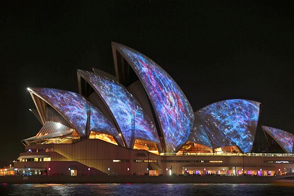 The Sydney Opera House, designed by Jørn Utzon, is lit up for the Vivid Sydney festival.