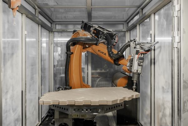 A seven-axis industrial robot was used to fabricate the shell of a pavilion at Stuttgart University due to its flexibility and precision.
