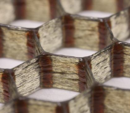 Researchers at Harvard University have developed a carbon-fiber reinforced epoxy ink, shown here printed in a hexagonal honeycomb.