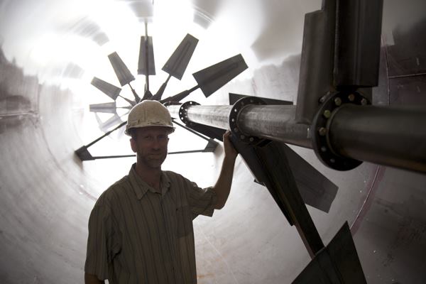 The Plant's executive director, John Edel, inside the 104-foot-long digester tube.